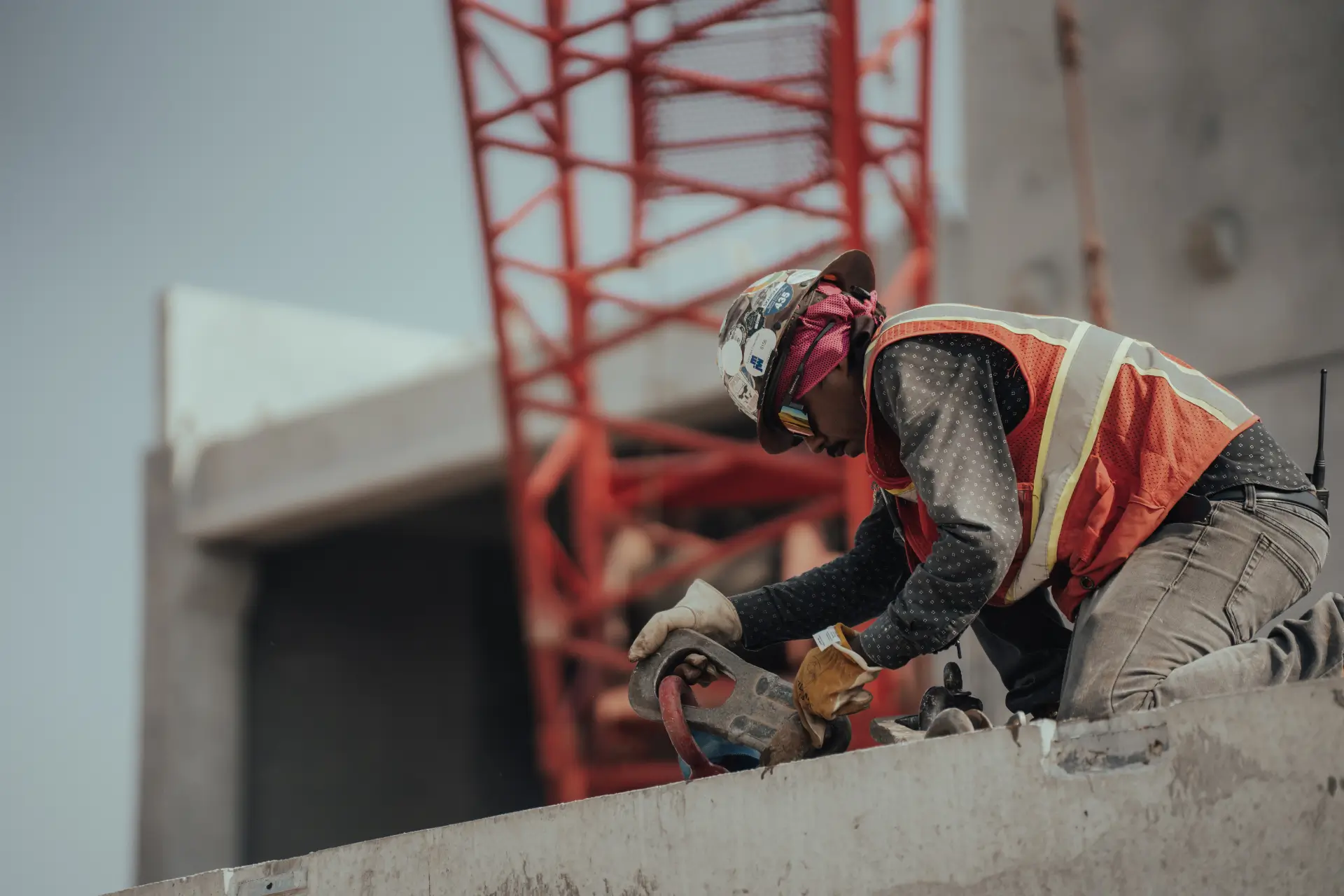 Metromont crew member attaching lifting hardware to a precast concrete panel